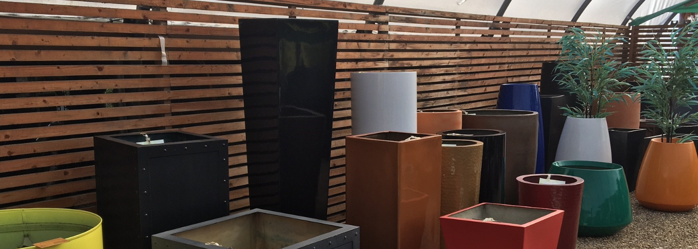 Selection of tall garden planters at Cedar Nursery, Surrey