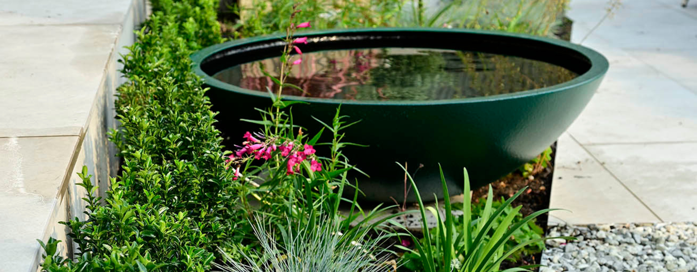 Fibreglass planter used as waterbowl