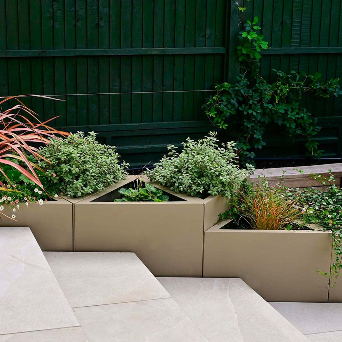 Fibreglass geo triangle garden planter. Surrey